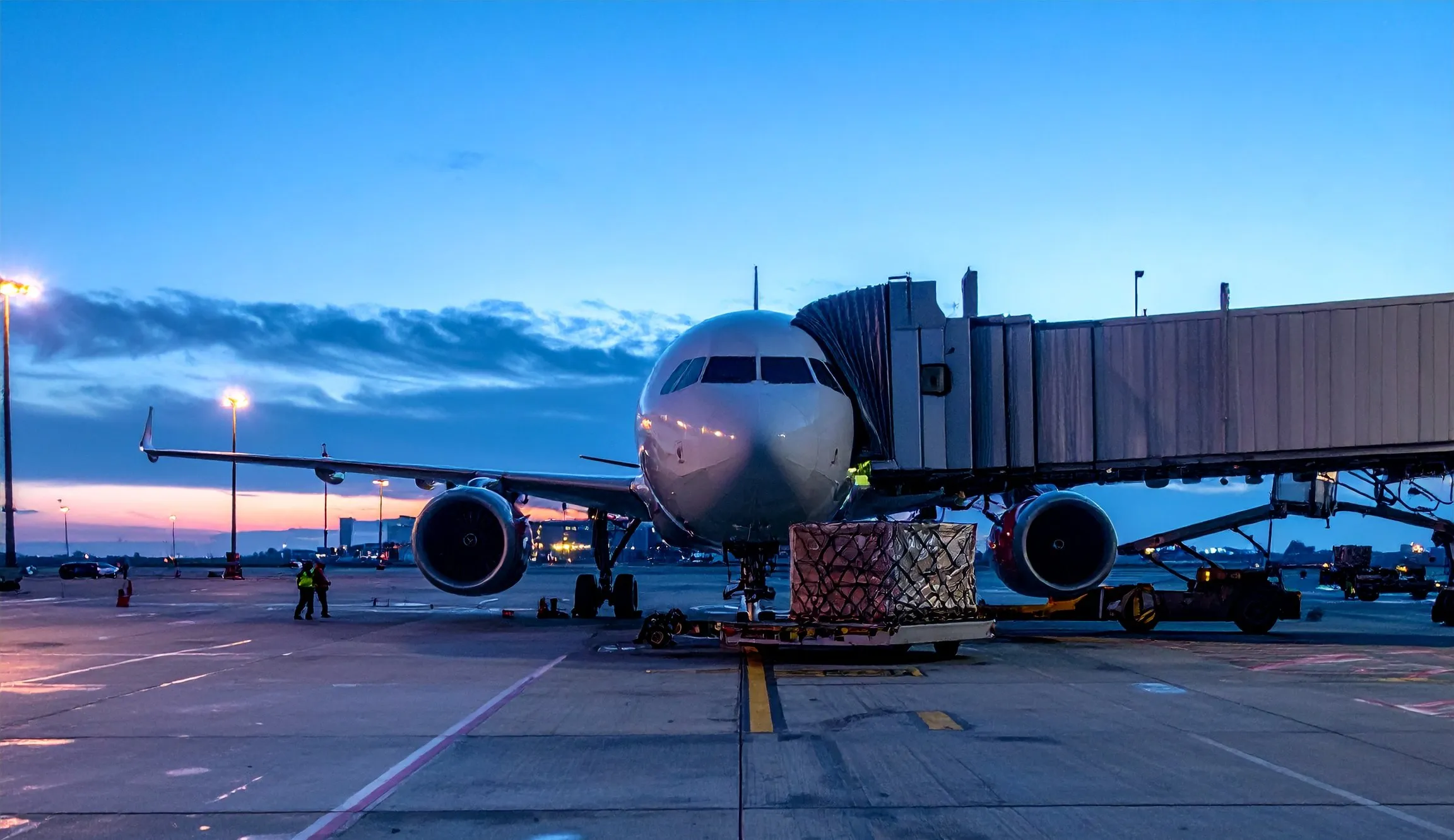 Cargo aircraft being loaded on the tarmac